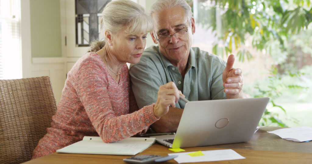 Older couple looking at computer